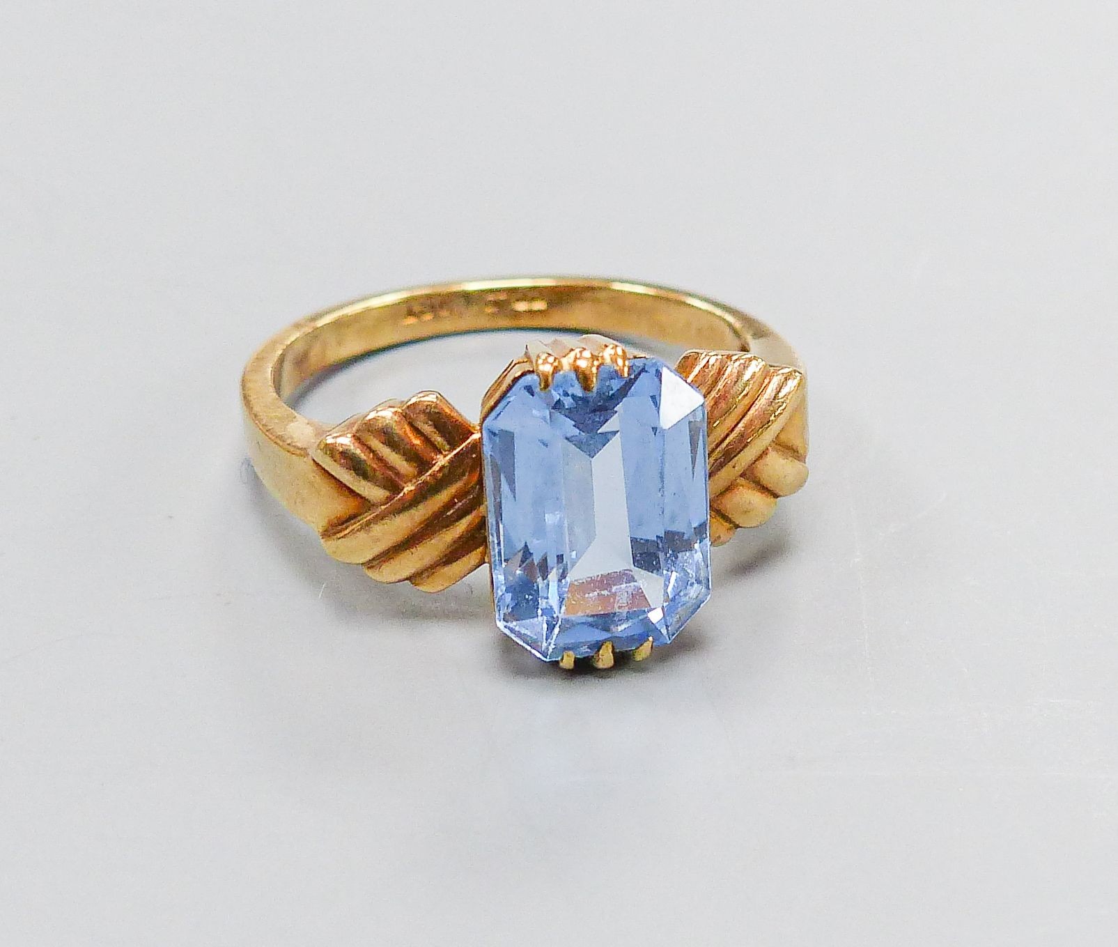 A 9ct and blue paste set dress ring, size O, gross weight 3.8 grams.